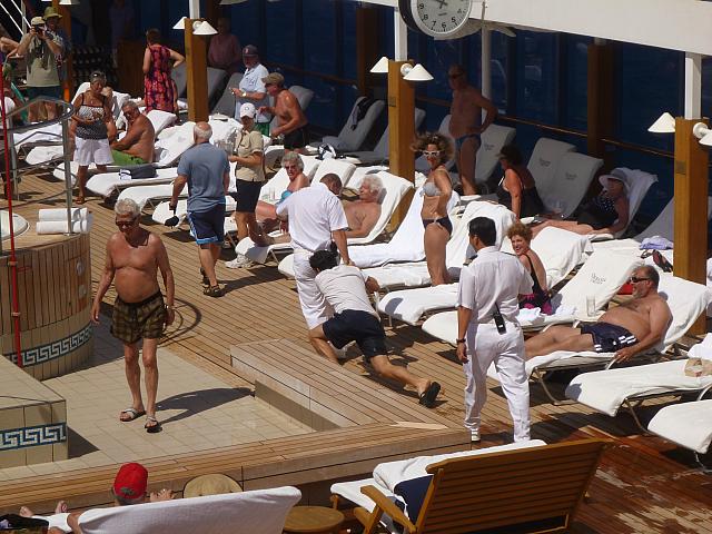 Member of the staff is brought before King Neptune for his 'punishment'