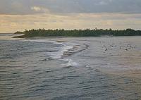 Passing through natural opening in coral reef to anchor in Maroe Bay.