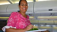 Flight attendant with fragrant tiare bud for each of us...right ear = available; left ear = 'taken'
